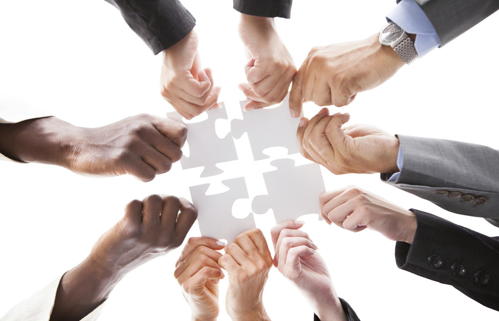 teamwork-puzzle-organized-pieces-together-100613905-large